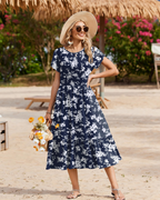 Robe Midi Florale Femme Elodie – Manches Pétales, Poches et Jupe à Volants